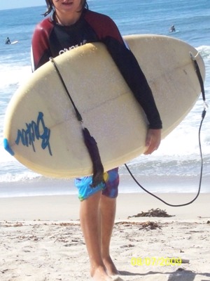chris with surfboard